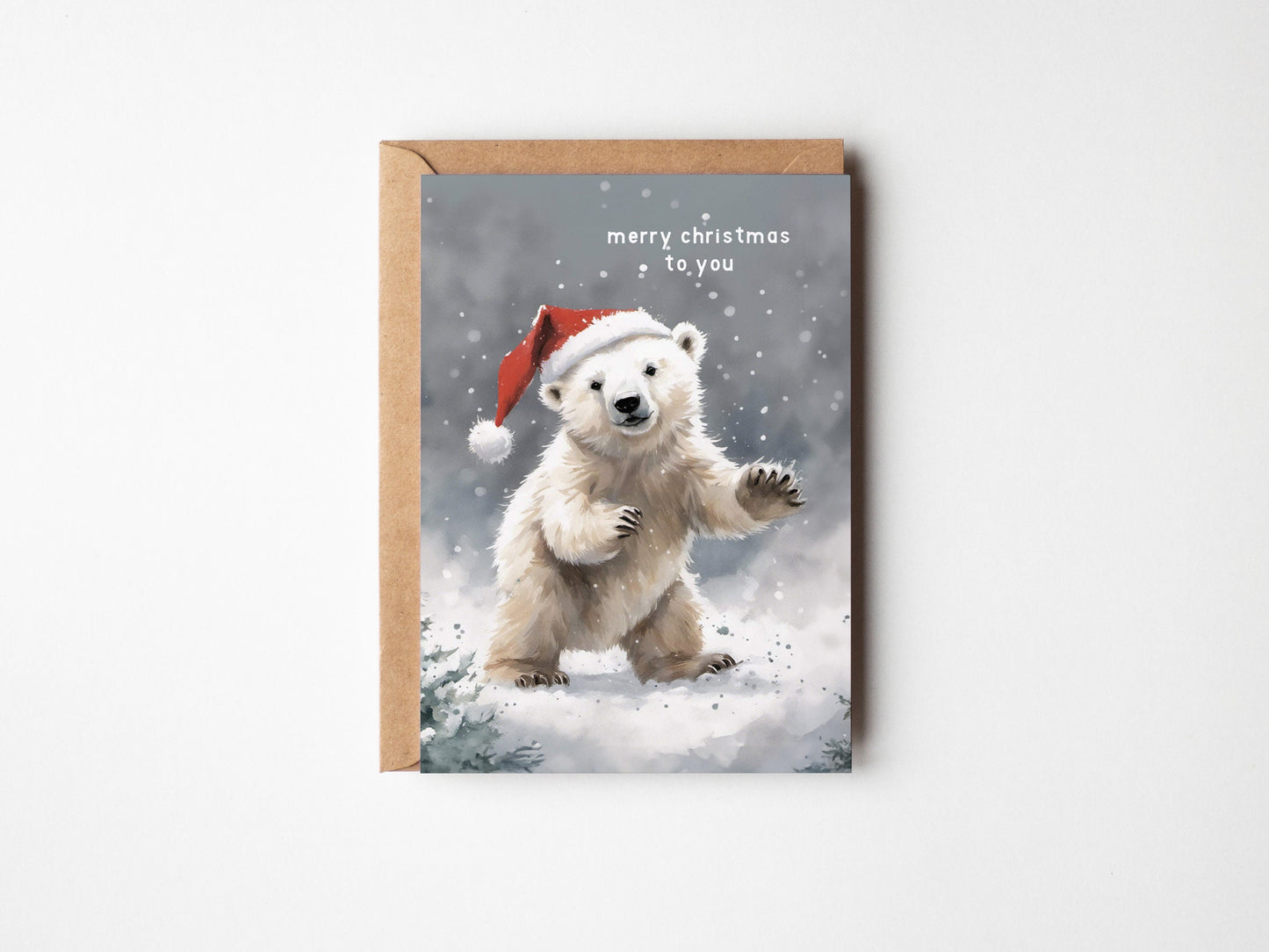 Cute Polar Bear on a Christmas card with Santa hat wishing you a Merry Christmas