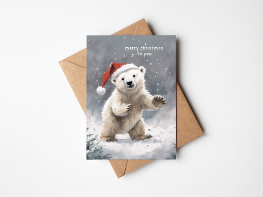 Cute Polar Bear on a Christmas card with Santa hat wishing you a Merry Christmas